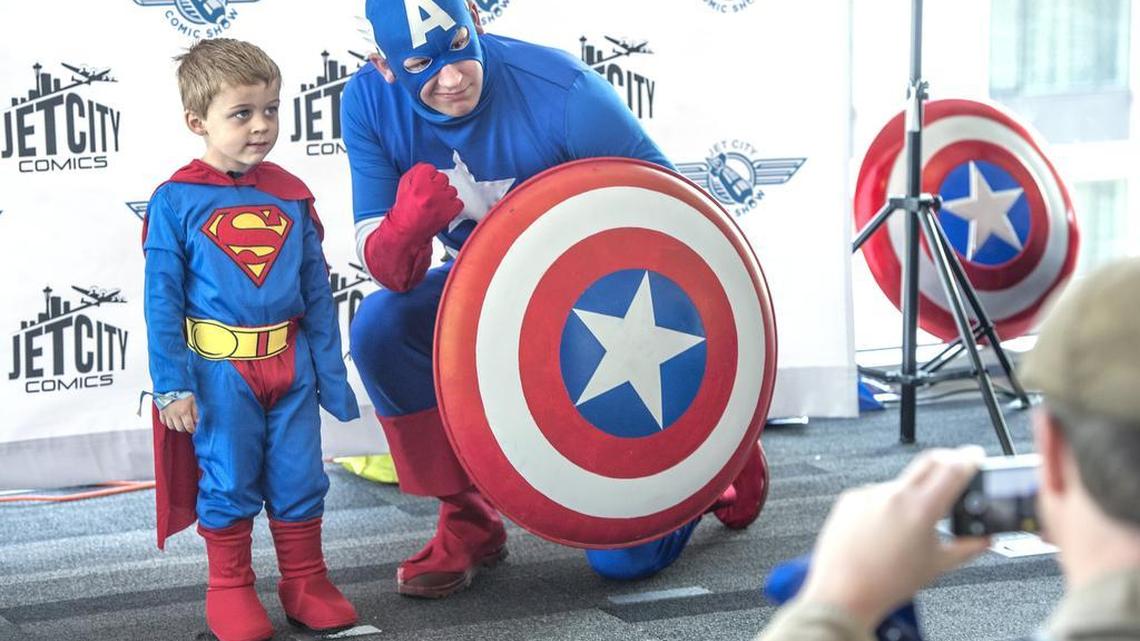 A shy Ethan Van Wyhe reluctantly submitted to a photo op with Captain America, otherwise known as A.J. Roberts from Comic Book Characters For Causes during the Jet City Comic Show in 2014. This year’s show will be Saturday and Sunday.