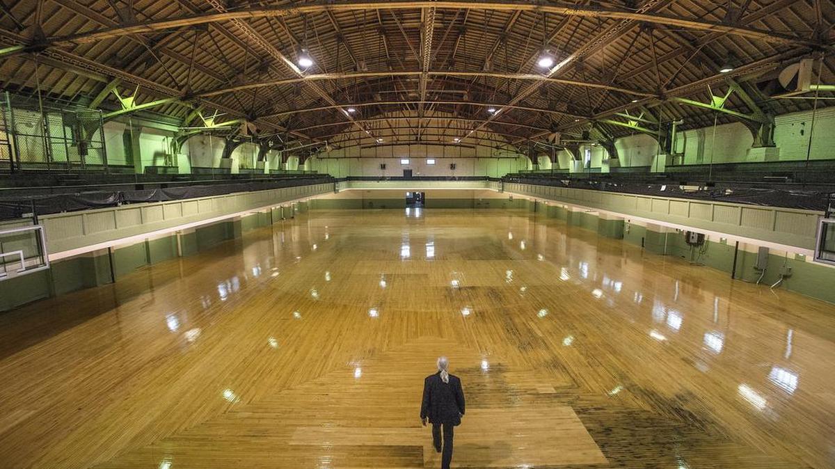 Scott Painter, director of operations for the Broadway Center for Performing Arts, is dwarfed by the cavernous space of the drill hall in Tacoma’s historic Armory building on Dec. 1. The Armory is being restored as an arts, entertainment and food venue by owner Fred Roberson, who will eventually gift it to the Broadway Center.