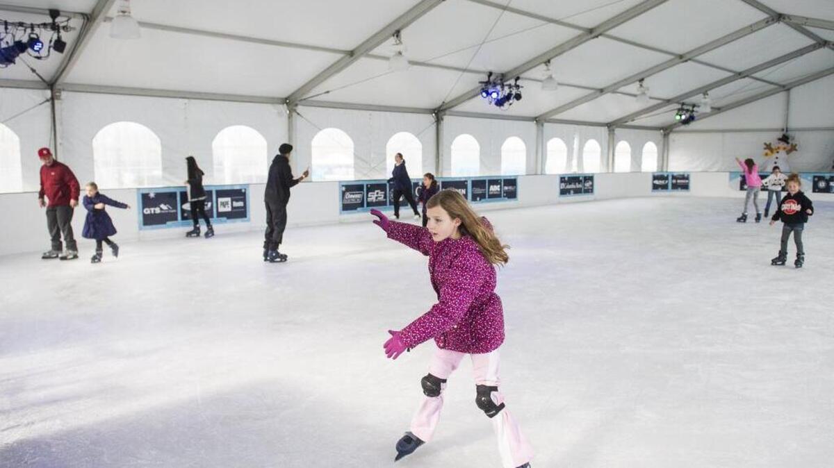 People skate at the Frozen Fountain ice skating rink in Point Ruston in 2017.