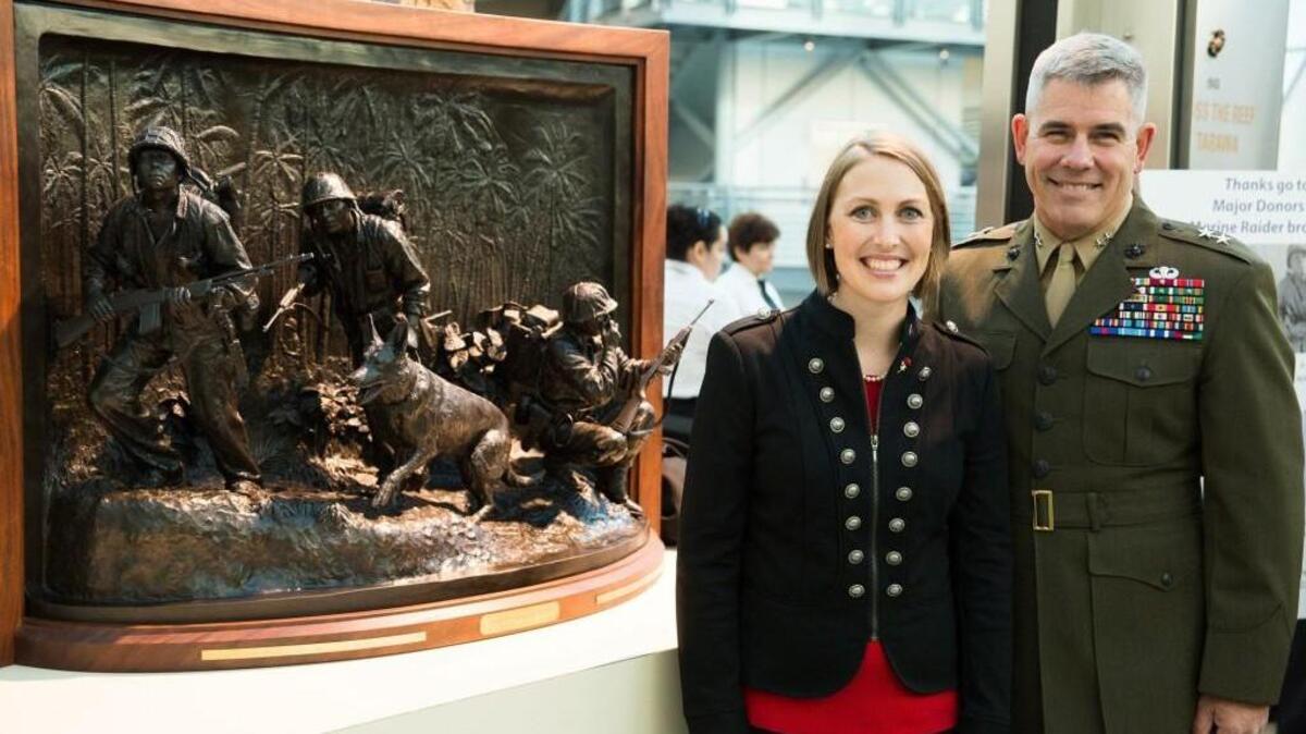 Mardie Rees and Marine Corps Maj. Gen. Joseph Ostermann stand next to Rees’ award-winning sculpture “Soul of the Forward and Faithful.”