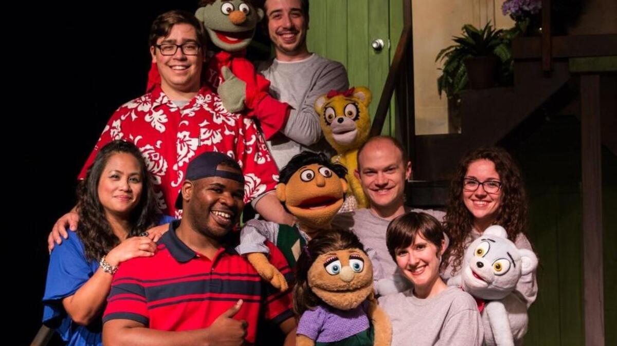 An ensemble cast blends live action and puppets in the adult comedy “Avenue Q” at Lakewood Playhouse.