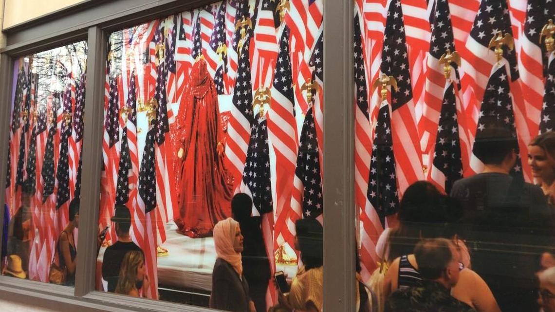 A still from “The Red Chador” performance art video by Anida Yoeu Ali in the Spaceworks Gallery window along Commerce Street in Tacoma.