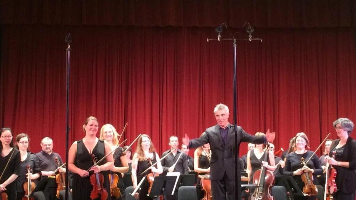 The Northwest Sinfonietta, with conductor David Lockington, finishes its concert Saturday in the Rialto Theater in Tacoma.