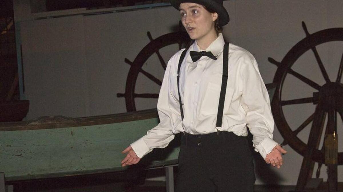 A School of the Arts student plays a historical Tacoma character in “Ghosts at the Balfour Dock Building” at Foss Waterway Seaport.