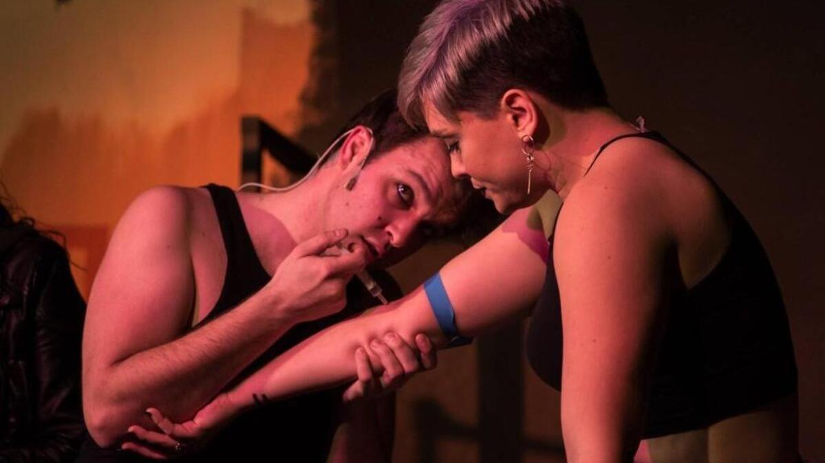 Mark Alford, as Johnny, and Dani Hobbs, as Whatshername, in the Lakewood Playhouse production of “American Idiot.”