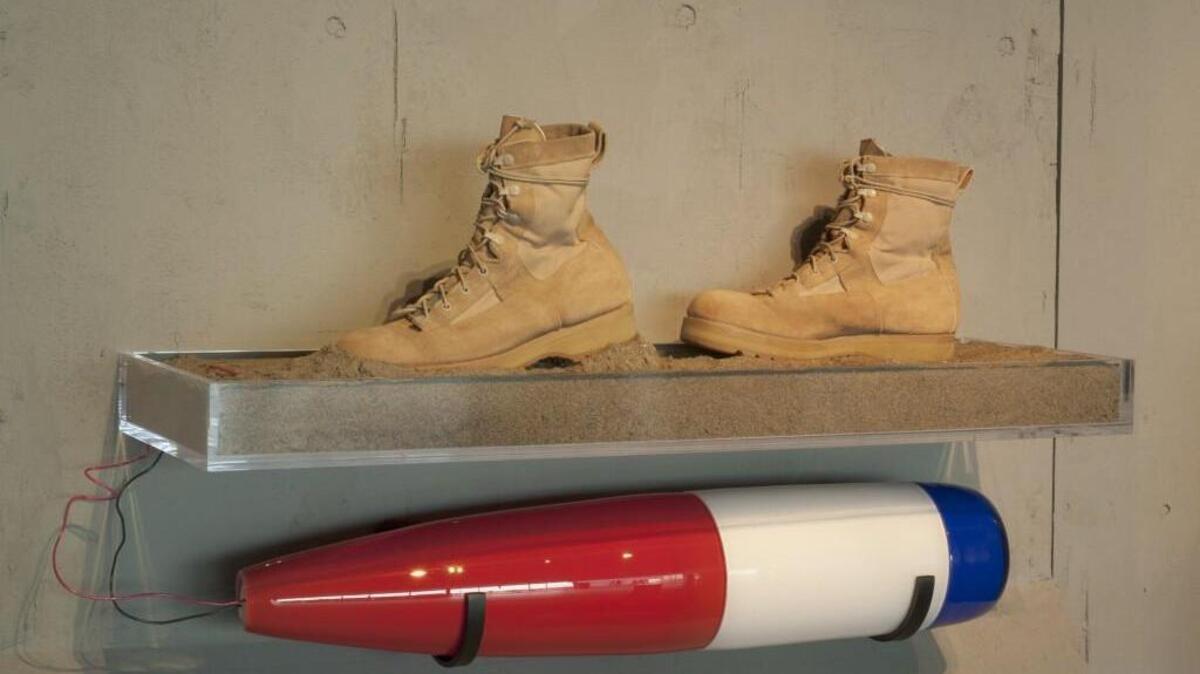 A piece by the Hot Shop Heroes team, “Nasty Surprise Underfoot,” is part of the Healing in Flames exhibit at the Museum of Glass.