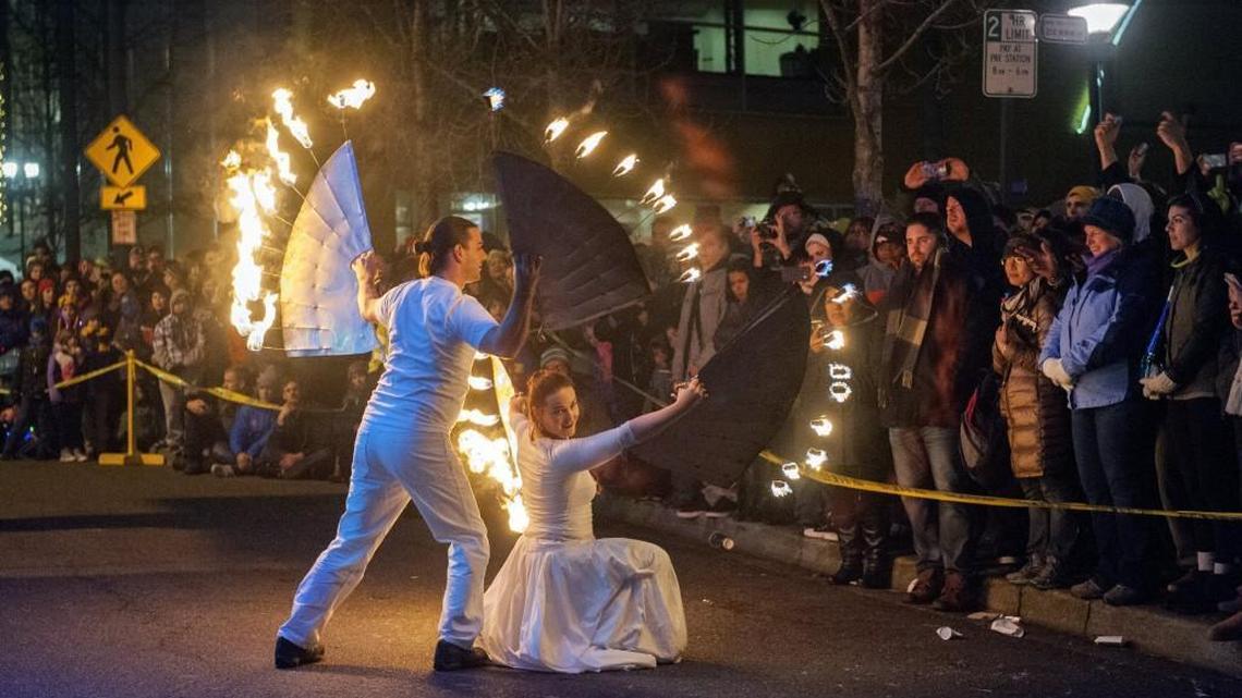 Fire performers entertain the crowd prior to the countdown to the New Year at Tacoma’s First Night celebration on Dec. 31, 2015.