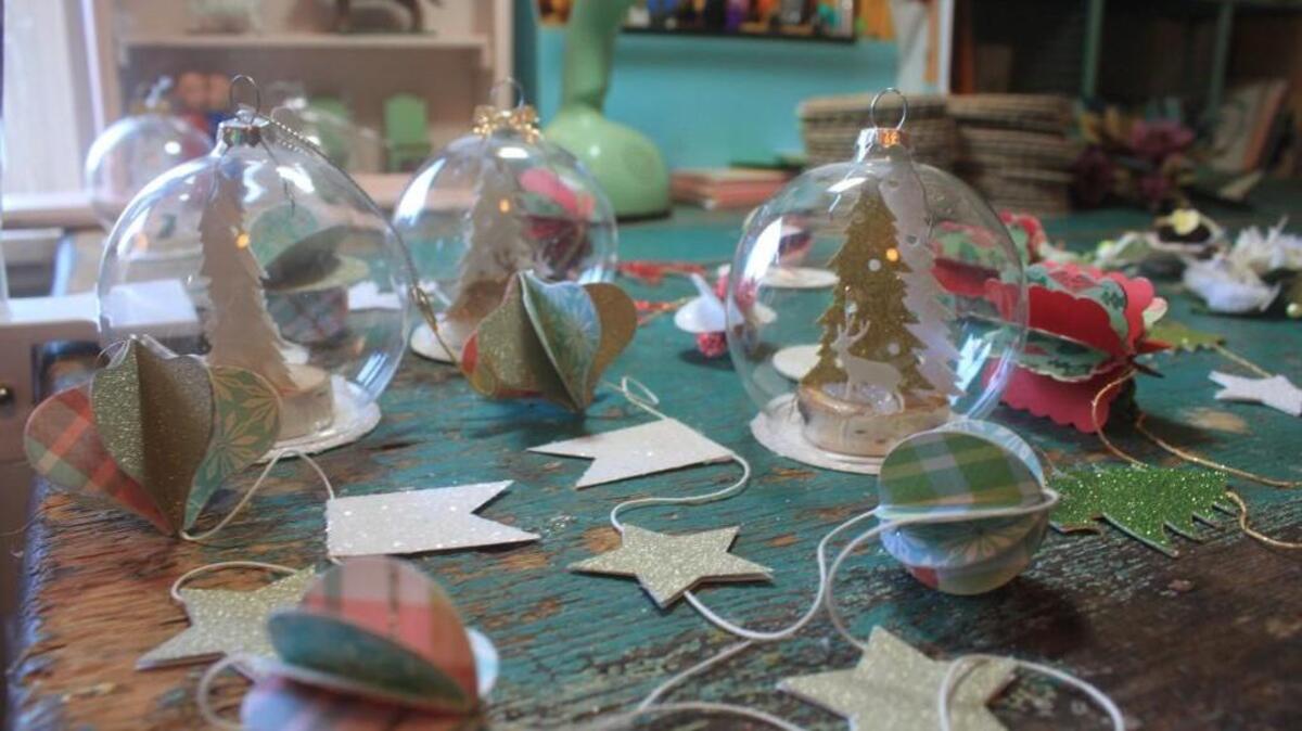 Paper garlands and holiday ornaments by Laurie Cinotto. She’ll sell them at the annual Tacoma is For Lovers Craft Fair at King’s Books, Tacoma, on Saturday.