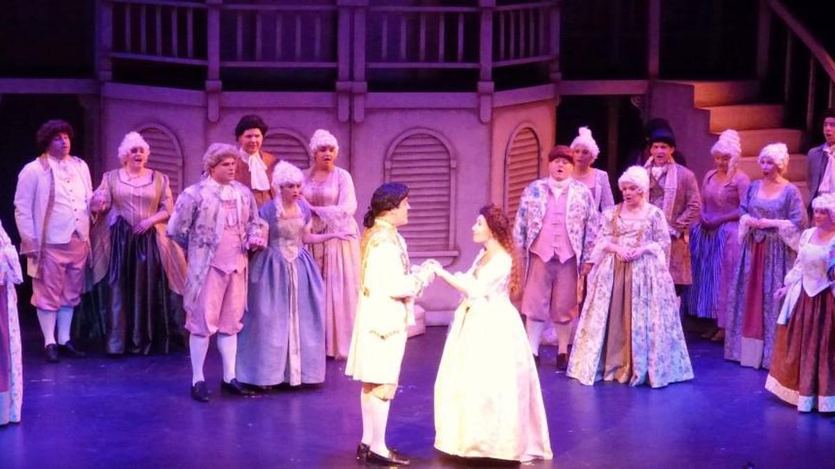 Bruce Haasl, center left, as Percy, and Trista Duval as Marguerite perform with the ensemble cast in “The Scarlet Pimpernel.”