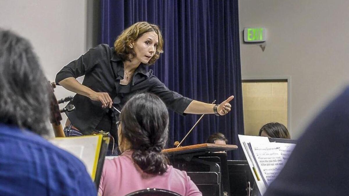 Sarah Ioannides, music director and conductor of Tacoma Symphony, leads a rehearsal of Stravinsky’s “Rite of Spring” on Monday.