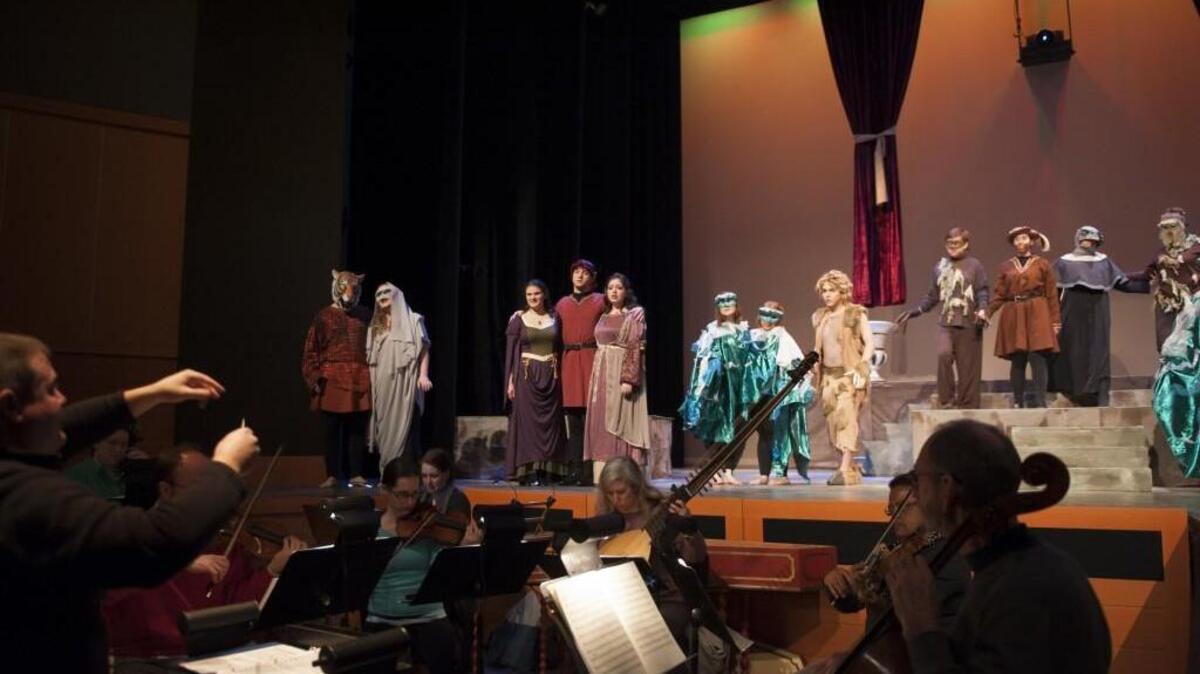 Jim Brown conducts the cast of PLU’s “Orpheus in the Underworld,” opening this week.