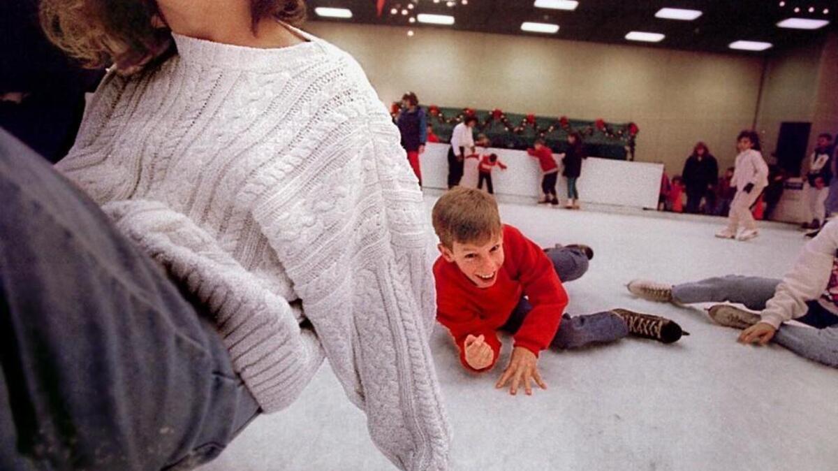 Garnet Neely of Seattle doesn’t mind having dragged down his companions at the Winterfest Ice Rink.