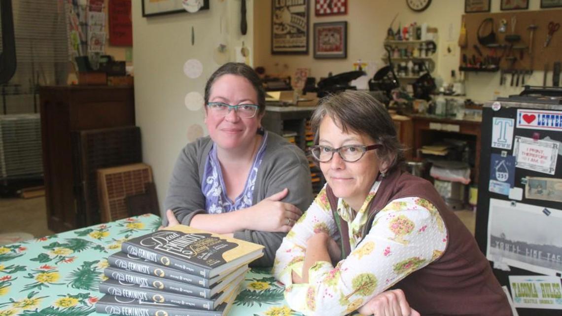 Illustrator Chandler O’Leary, left, and letterpress artist Jessica Spring in Spring’s Tacoma studio. The two will launch their new book “Dead Feminists” Oct. 11.
