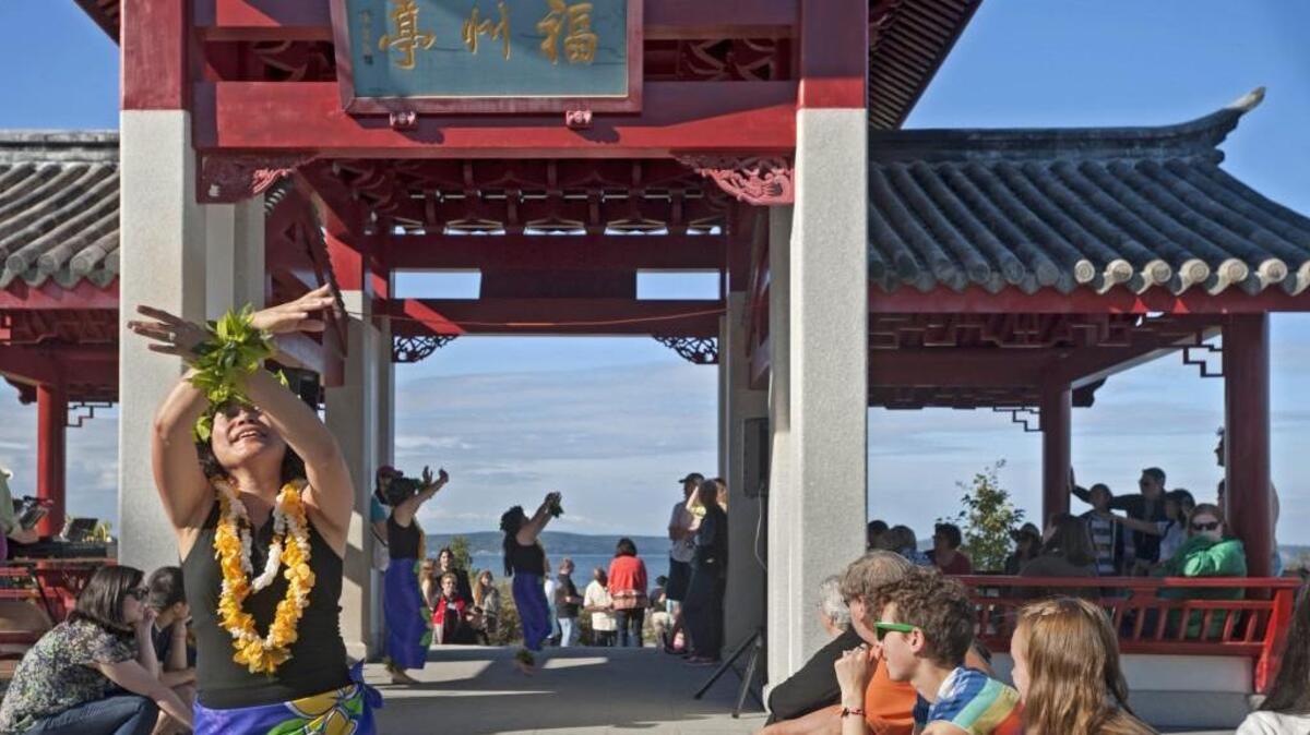 Kris Delicana and others from Kaimiola’s Polynesian Dancers perform in the pagoda at the Tacoma Moon Festival in 2012.