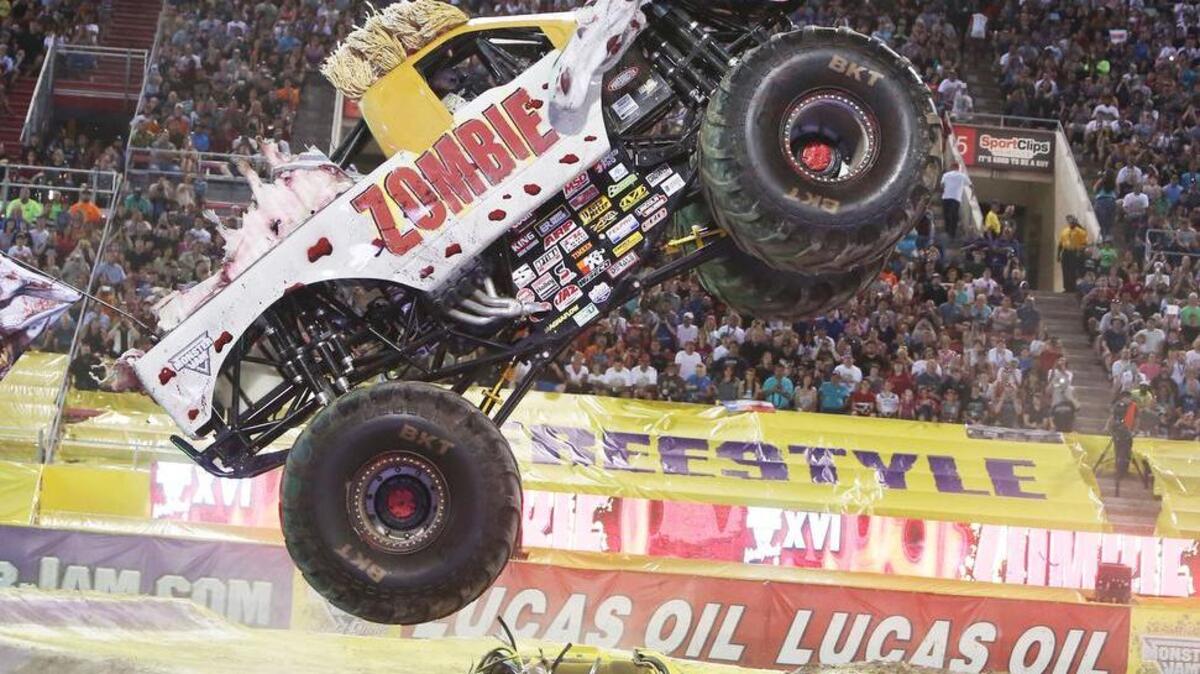 Monster truck, Zombie, driven by Donald Bari Musawwir, jumps high during the Monster Jam World Finals Freestyle XVI competition in 2015 in Las Vegas.