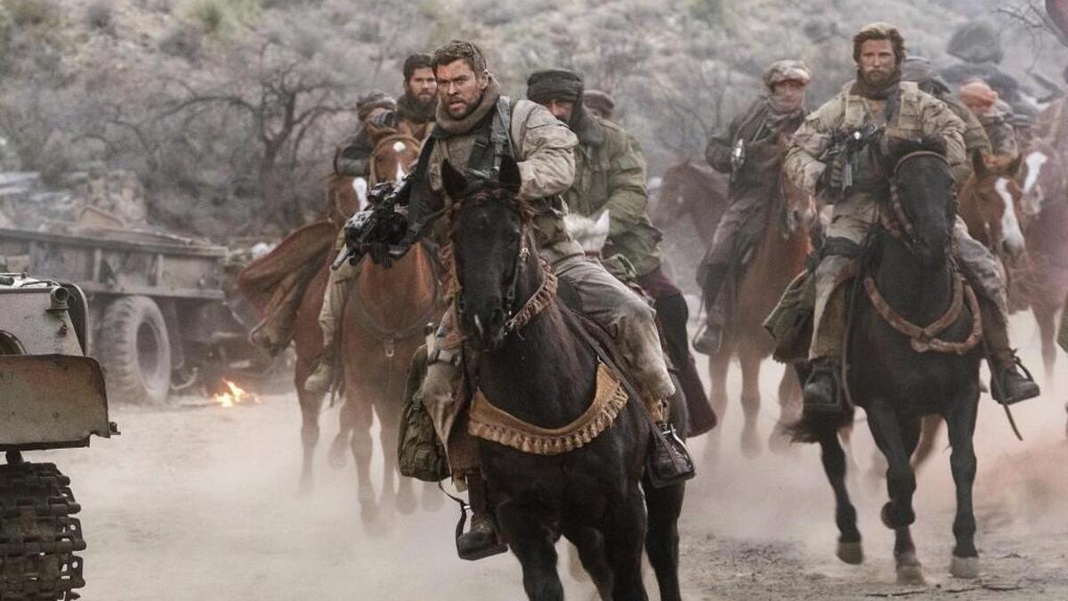 In “12 Strong,” Chris Hemsworth, center, leads a detachment of 12 Special Forces soldiers sent into Afghanistan to strike back at the Taliban for the 9/11 attacks.