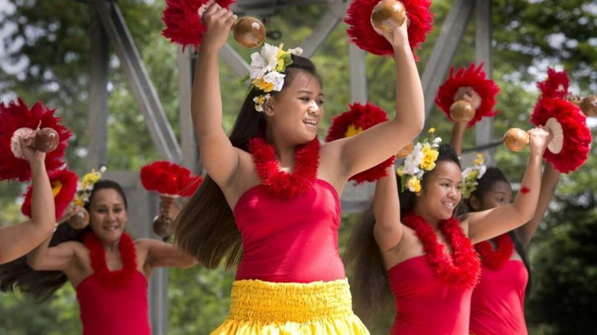 Tihane Devera, center, with Hula Halau ‘O Kealaakua Naniloa Mana’oakamal Hawaiian Dance Group of Lakewood performed the hula at Ethnic Fest in Wright Park in 2016.