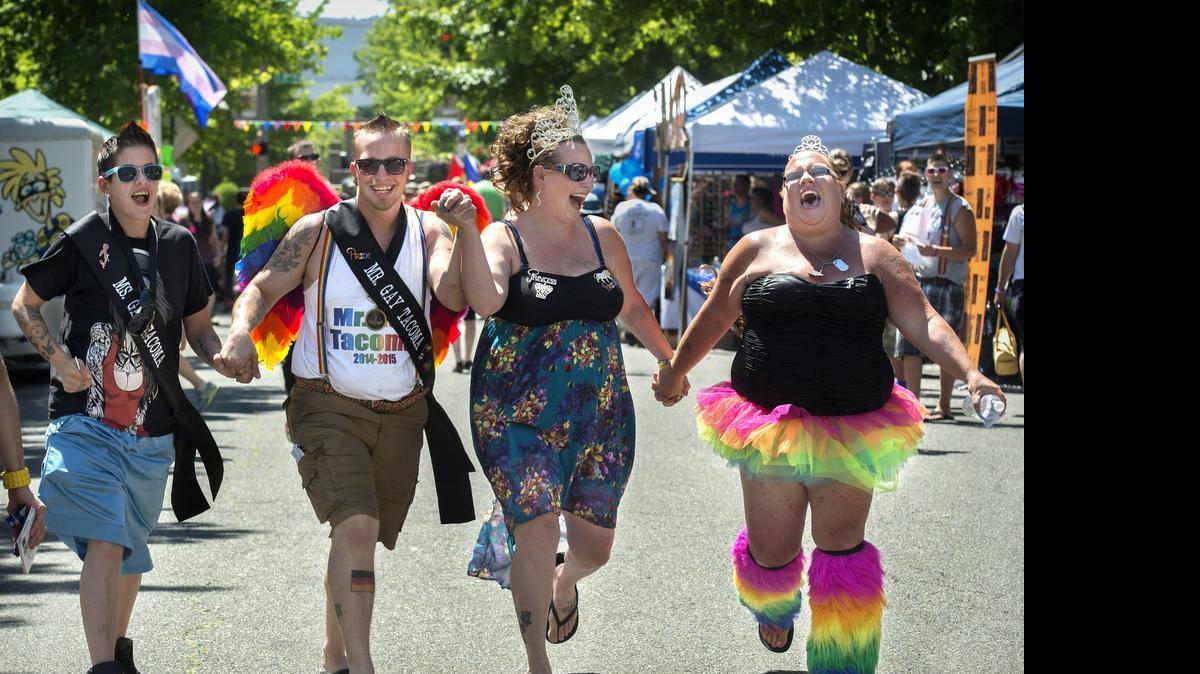 
Ms. Gay Tacoma Lili Hadway, left to right, Mr. Gay Tacoma Hayden Eyesli, Imperial Princess Alicia Ross, and debutante Angela Hadway enjoy the Tacoma Pride Festival in 2014.
