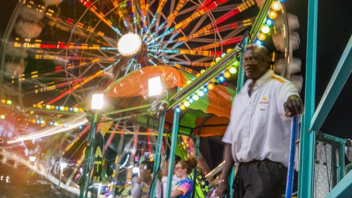
Funtastic employee Marvin Ross operates the Tilt-a-Whirl at the Washington State Fair in Puyallup in 2014.

