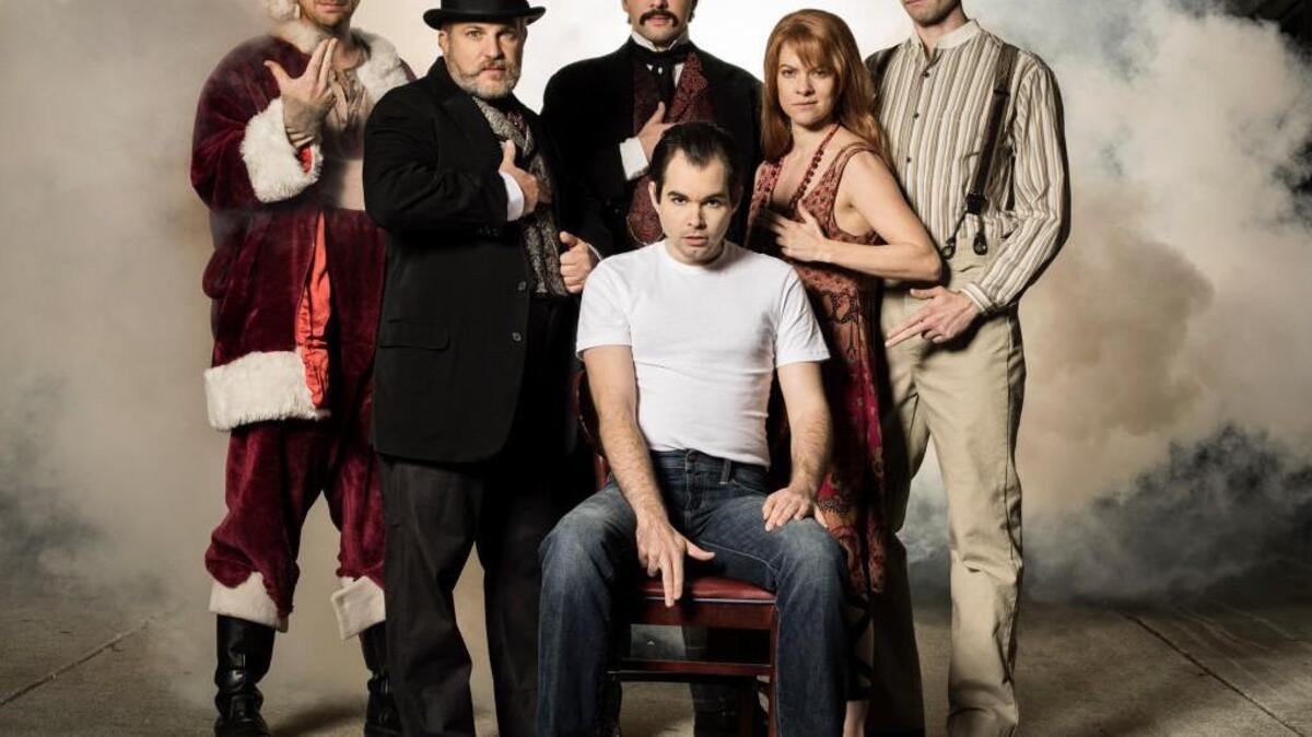Members of the company of Assassins, a co-production presented at ACT — A Contemporary Theatre, from left, Samuel Byck (Matt Wolfe), Charles Guiteau (Rich Gray), John Wilkes Booth (Louis Hobson), Lee Harvey Oswald (Nathan Brockett, seated), Lynette “Squeaky” Fromme (Laura Griffith) and Giuseppe Zangara (John Coons).