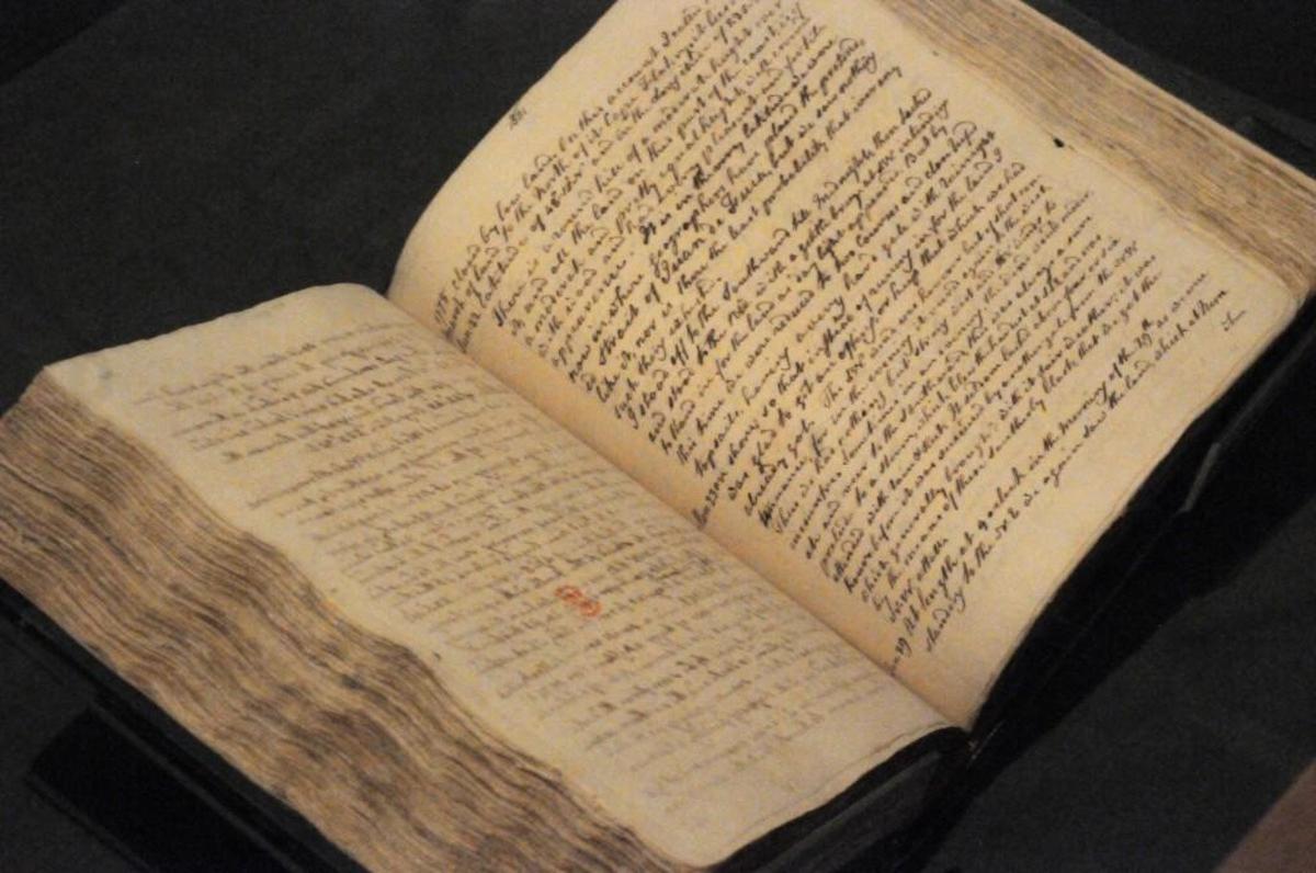 The handwritten journal of Capt. James Cook is open to a page on which he describes Cape Flattery, Washington, on March 22, 1778. The explorer’s time in the Northwest is now chronicled at the Washington State History Museum.
