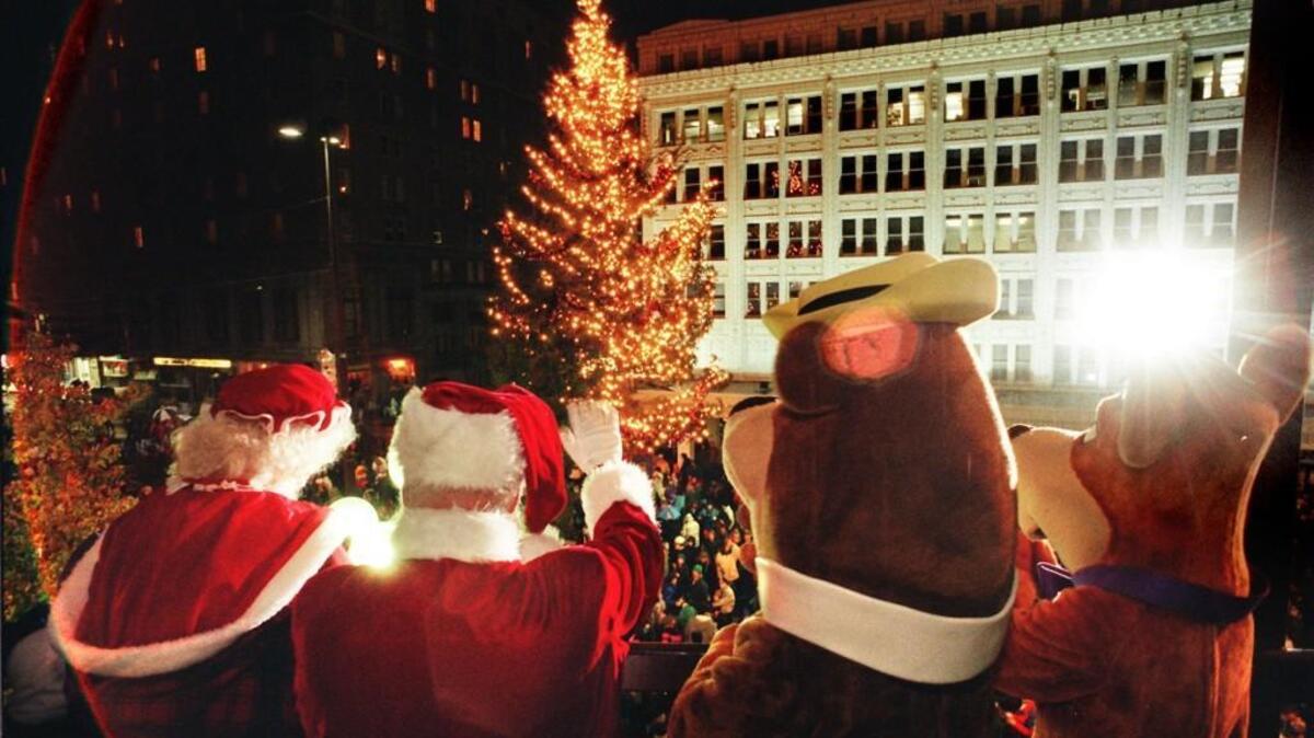 Santa, Mrs. Claus, Yogi and Mrs. Yogi ring in the Holiday season at the Annual Tacoma Tree lighting ceremony in 1995.