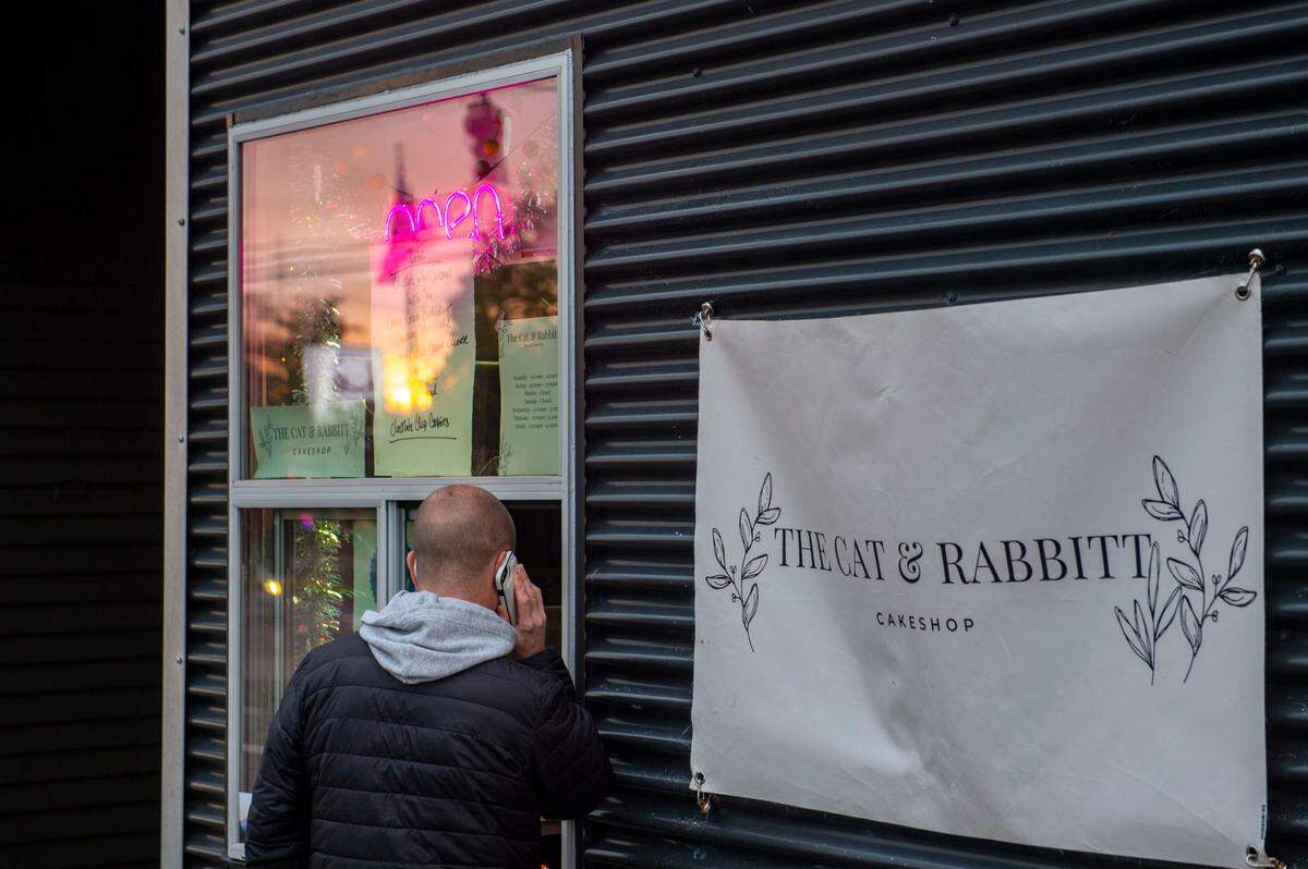 Guests order and pick-up slices of cake from the walk-up window of The Cat & Rabbitt Cake Shop, located at 2811 6th Ave. in Tacoma.
