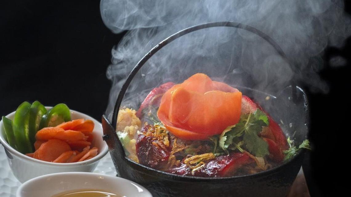 A sizzling com tho ga roti dish at Pho Puyallup in Puyallup. Diners never have to worry it might arrive cool.