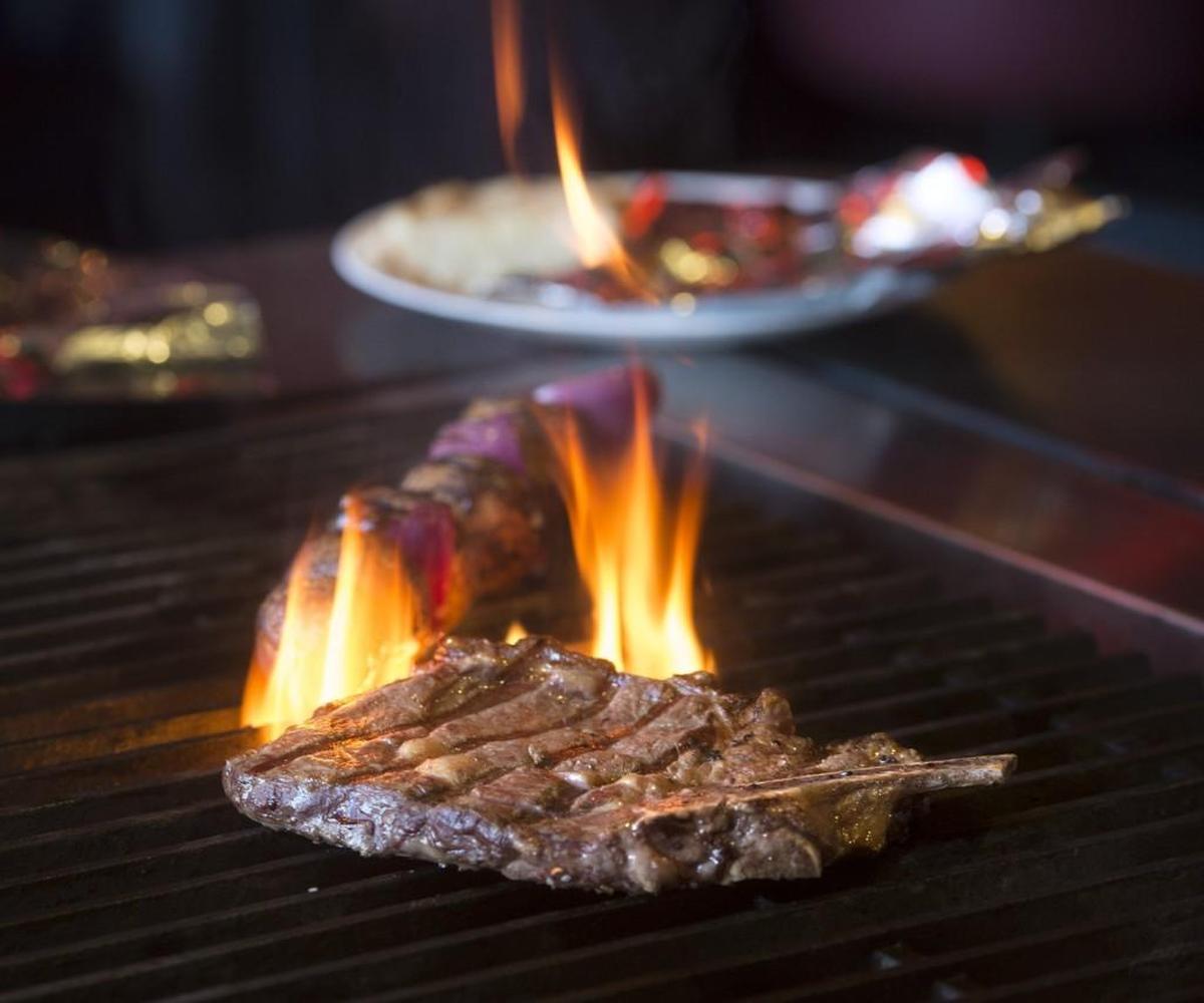 A rib steak on the grill at the Zodiac Supper Club in Tacoma.