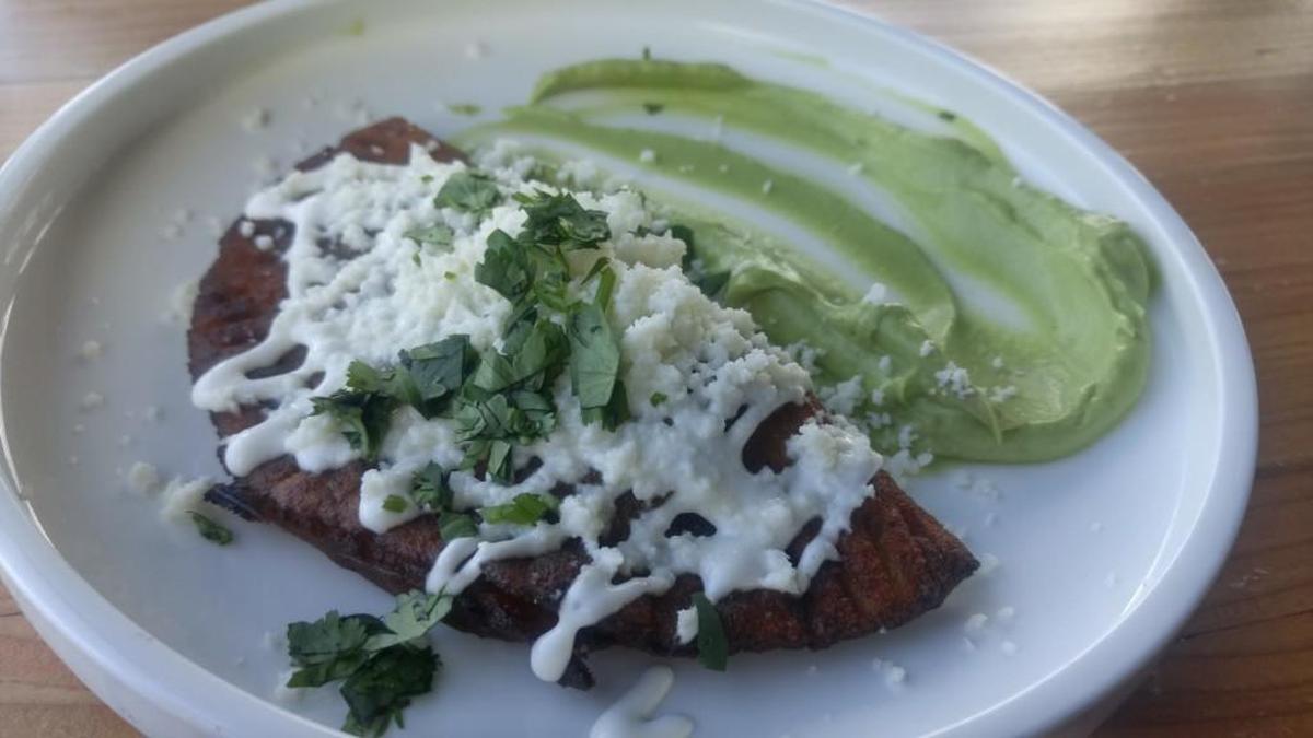 A plantain and black bean empanada.
