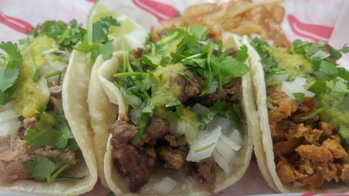 Tacos are served with grilled onions at TacoRico in Milton.