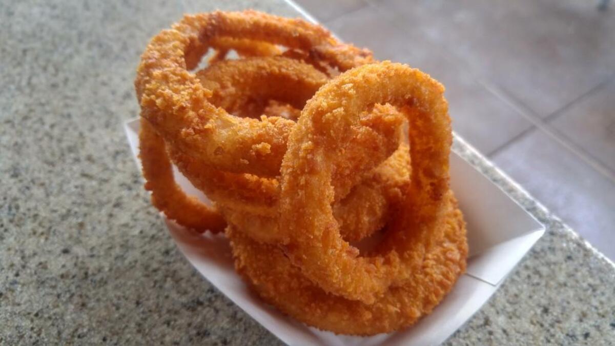 Crunchy, breaded onion rings from The Habit Burger Grill.