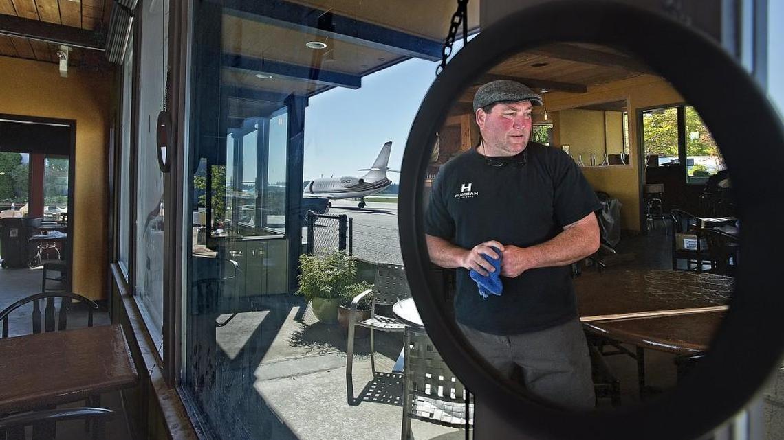 Pat Nagle, owner of the Harmon Brewing Company, checks out the view of the the new Hub Gig Harbor restaurant at the Tacoma Narrows Airport when it opened in 2013. His newest restaurant is in Puyallup.
