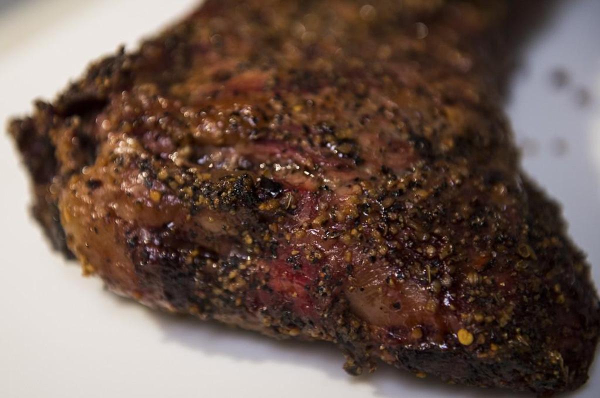 A close examination of the tri-tip reveals a hearty amount of pepper and spices. Photographed at Rib Ticklers in Gig Harbor, Wash., on Friday, Nov. 3, 2017.