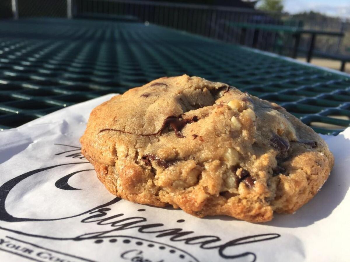 Find The Original, a Belgian chocolate and walnut cookie, served warm, at the Bite Me Inc. stand on the upper terrace walkway at Cheney Stadium.