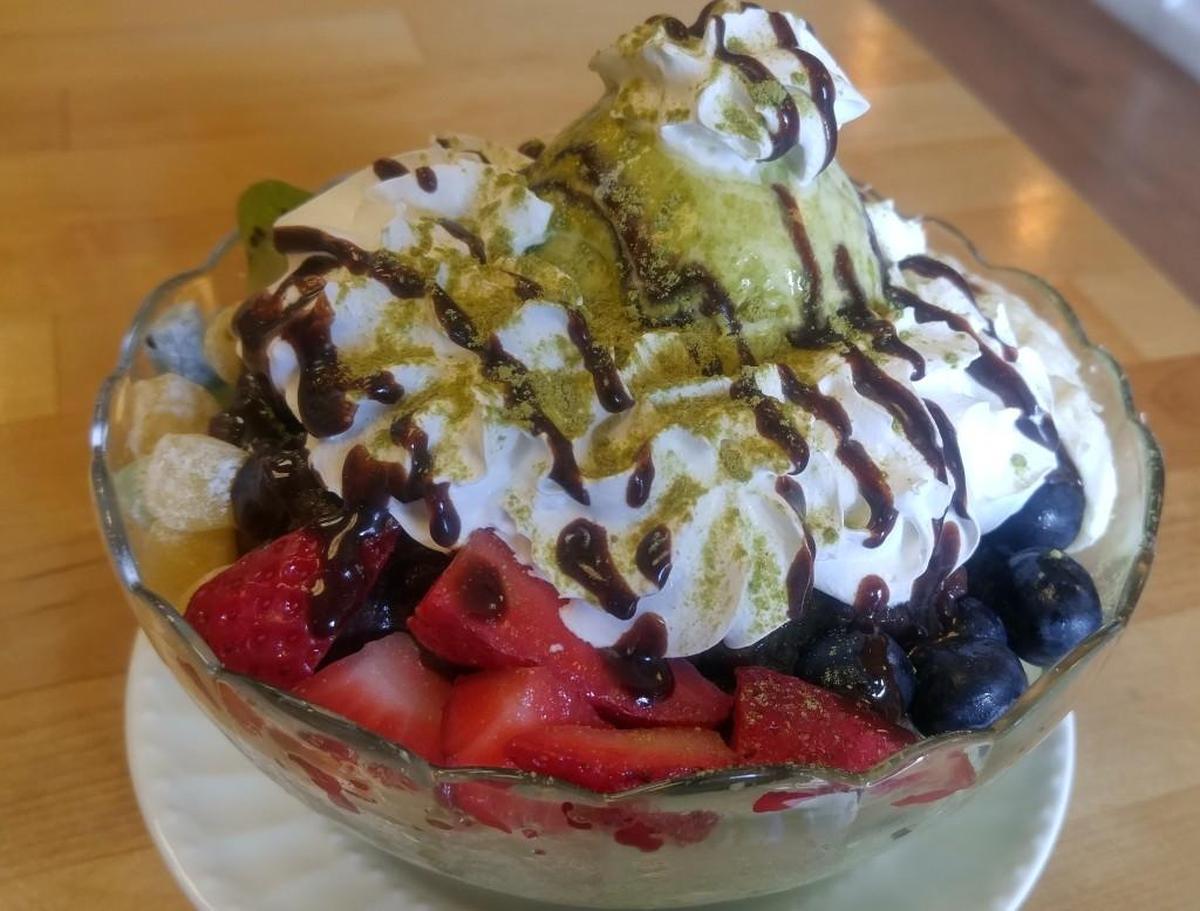 Green tea patbingsu is topped with fresh fruit at Coffee Kitchen in Lakewood.