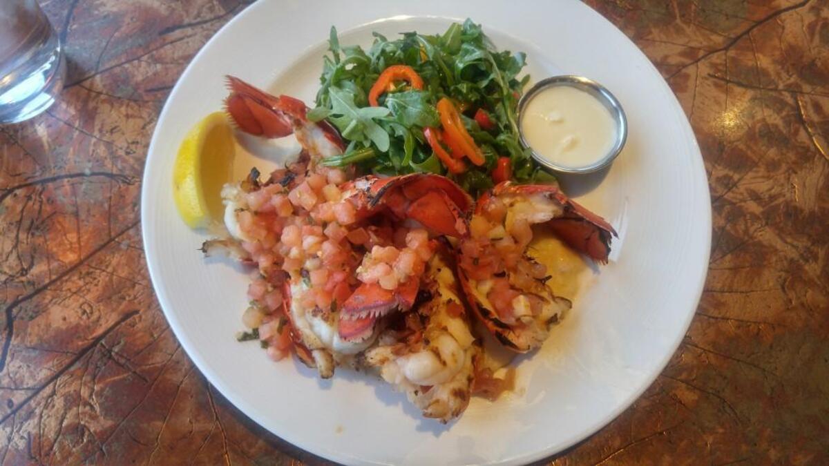 Grilled Maine lobster tails with brown butter dipping sauce.