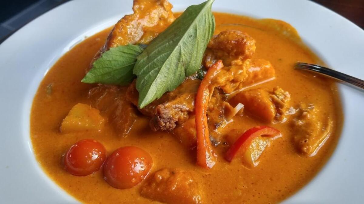 Duck curry in a vibrant curry broth from Thai Pepper.