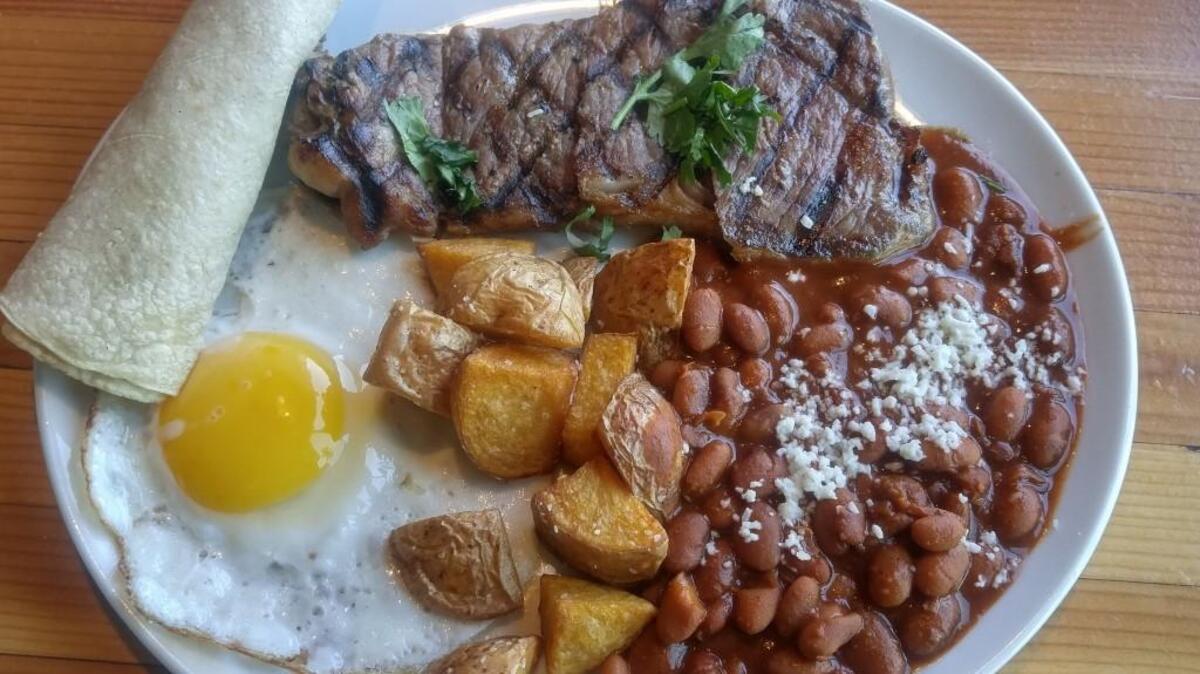 Steak and eggs with beans and roasted potatoes at Casco Antiguo