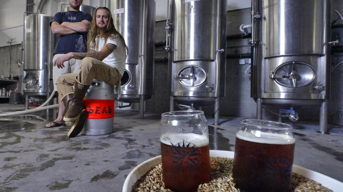 Mike Runion and Travis Guterson, right, co-owners of 7 Seas Brewing, pictured in 2009 when they opened their first brewery in Gig Harbor. The duo is now expanding to large taproom and production facility in downtown Tacoma.