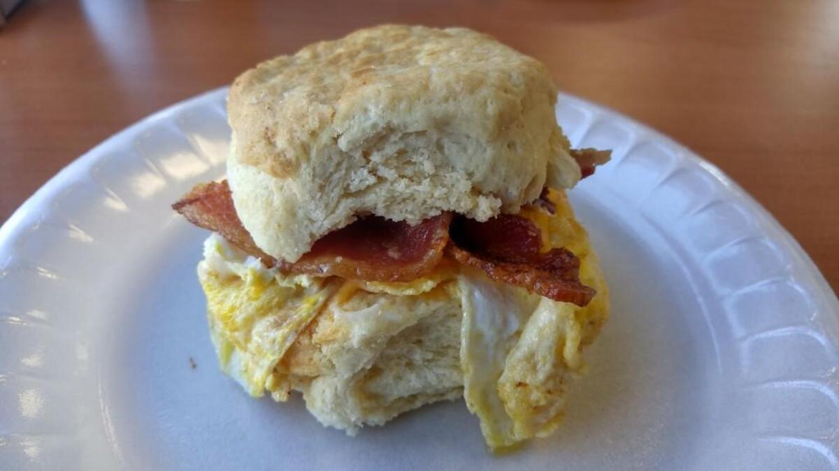 A biscuit breakfast sandwich with eggs, cheese and bacon from Biscuit House in Lakewood.
