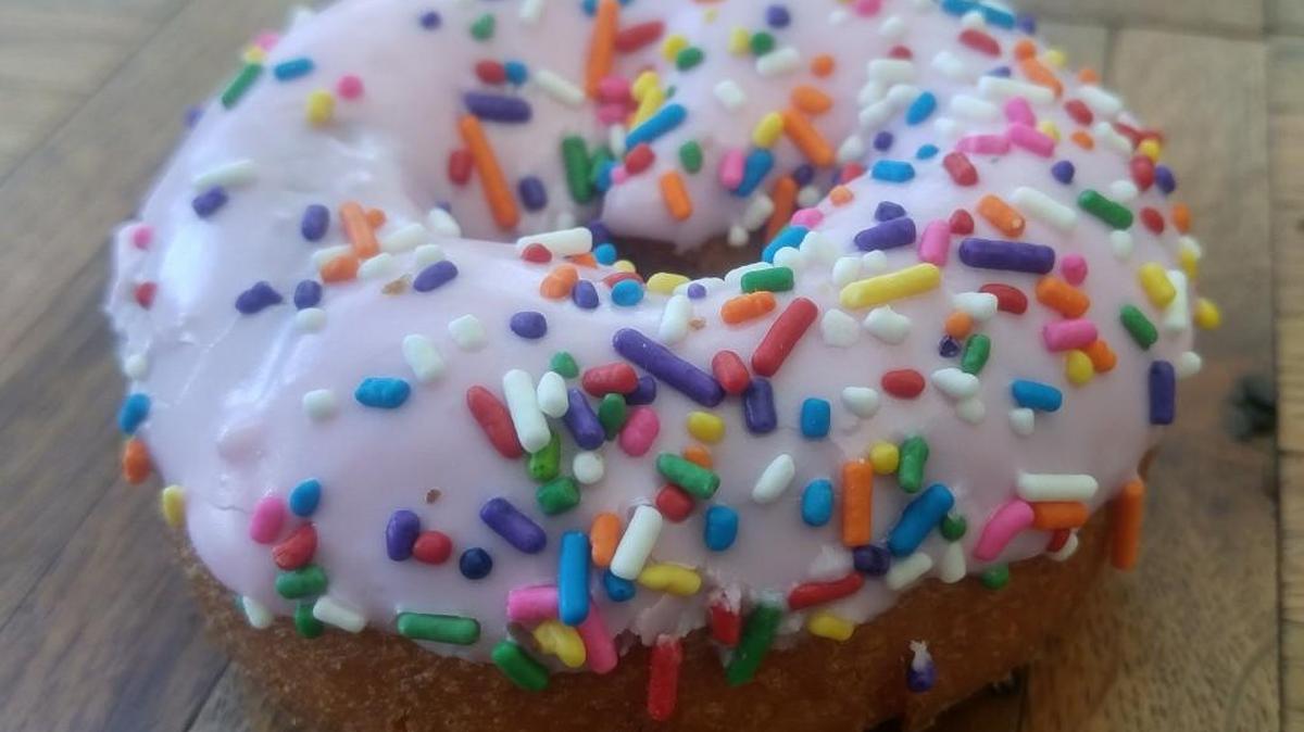 A pink rainbow frosted cake doughnut at Top Pot Doughnuts in the Proctor neighborhood.