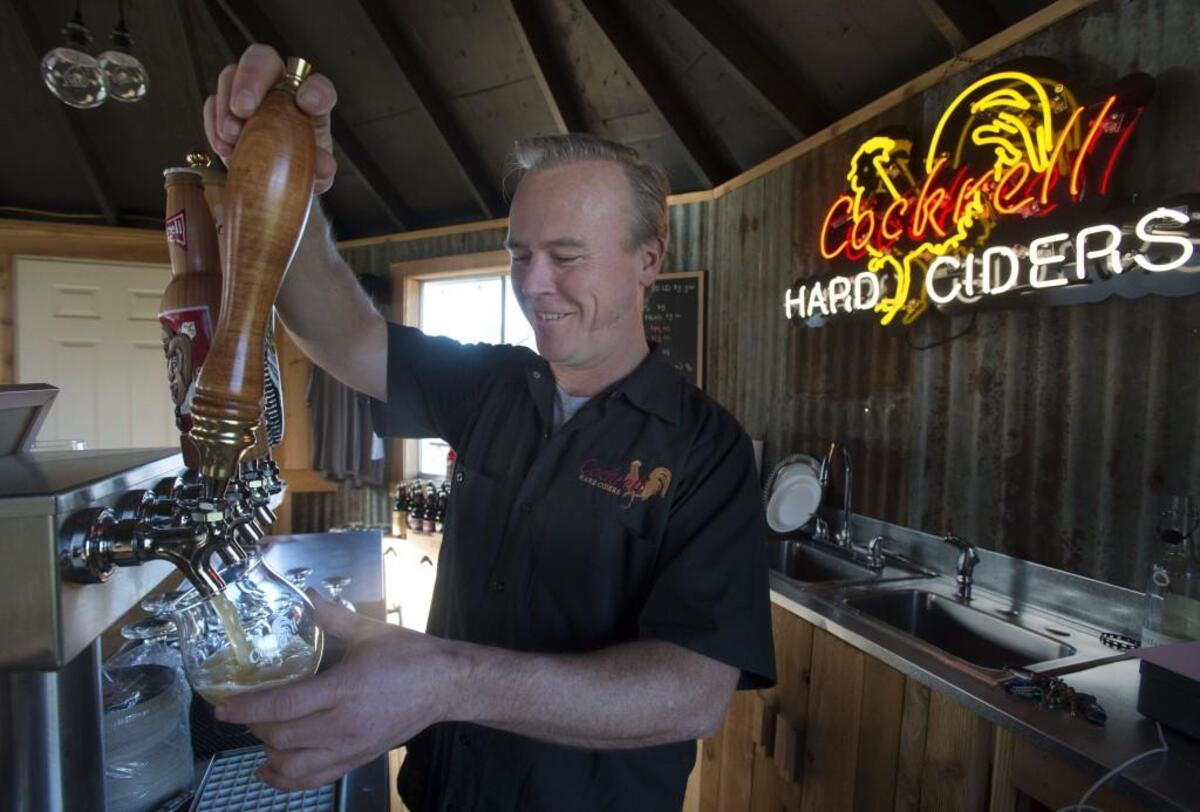Owner Rich Cockrell at work in his Puyallup tasting room in 2014. Cockrell will be among the cider makers at Cider Swig on Saturday, Sept. 24 in Tacoma.