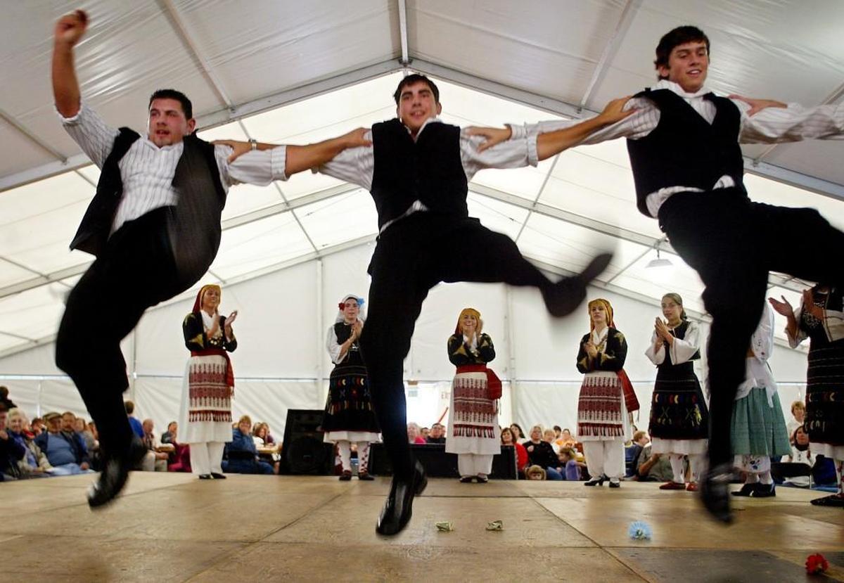High-stepping members of the Zephyros dance troupe perform at Tacoma’s annual Greek Festival at St. Nicholas Church.