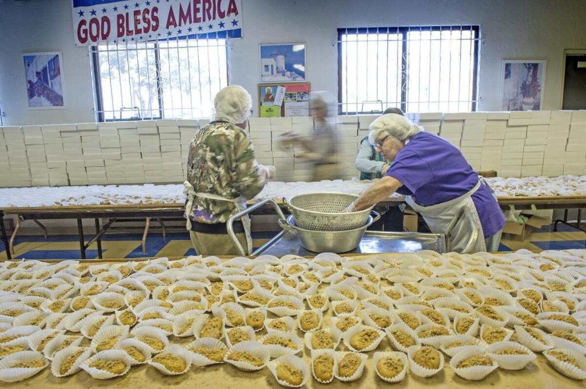 Members of St. Nicholas Greek Orthodox Church in Tacoma churn out thousands of traditional Greek pastries in the weeks leading up to the annual festival. This photo shows volunteers in the kitchen in 2015.
