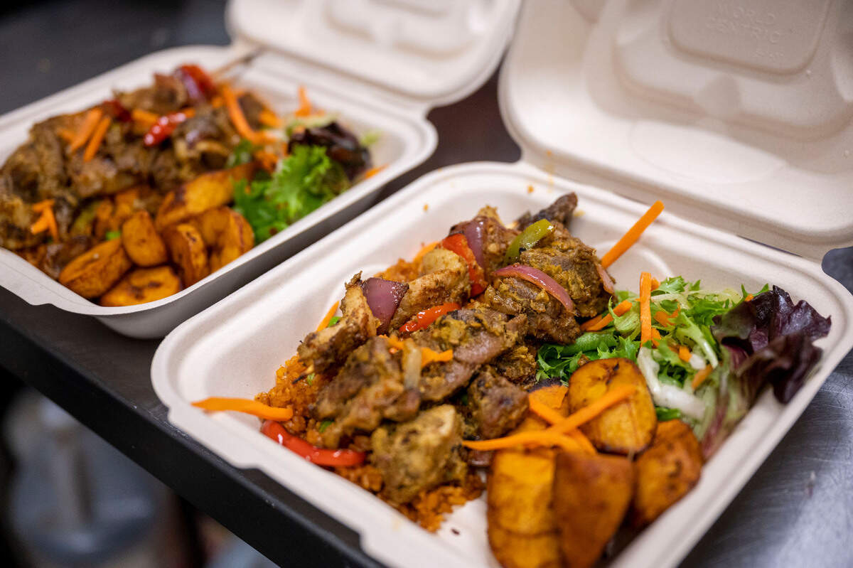 Afella Jollof Catering’s goat dibi with nokoss, a spicy Senagalese paste, and fried plantains awaits pickup at Spice Bridge in Tukwila.