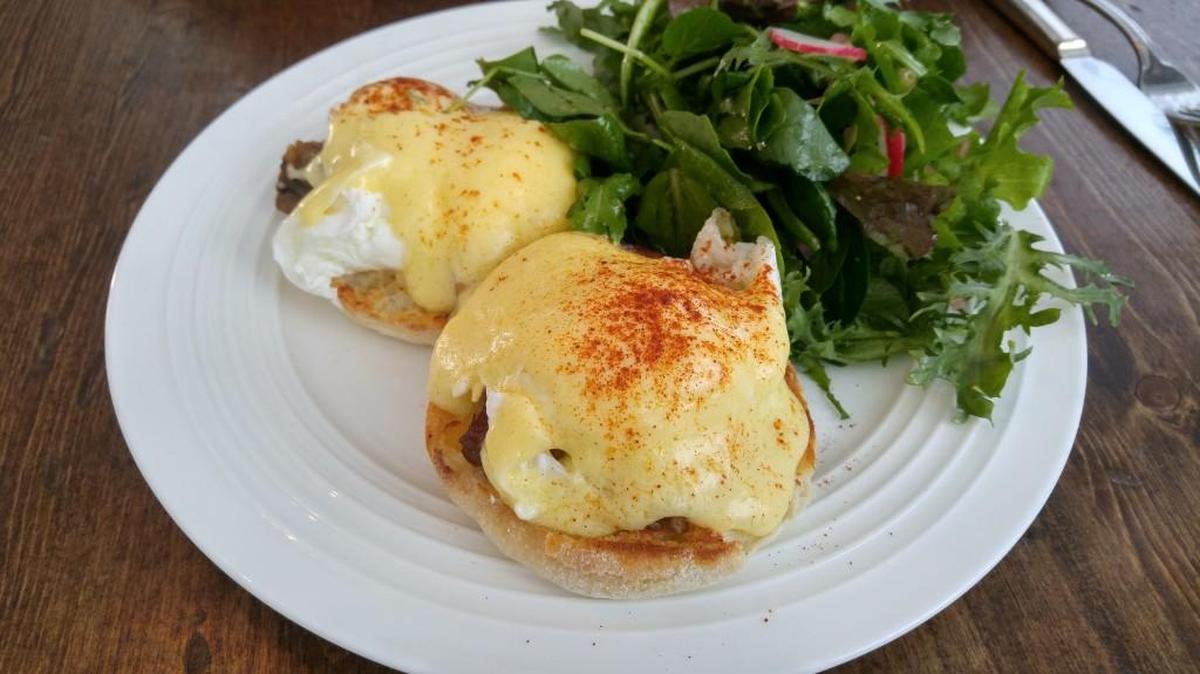 The pork belly Benedict at Sel is served with supple wedges of slow-cooked pork belly and a salad dressed with sherry vinaigrette.