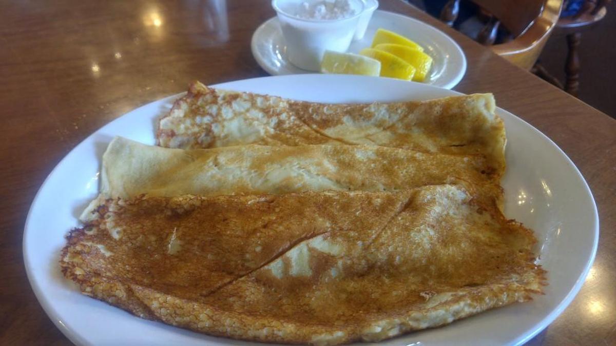 The Swedish cakes at Mrs. Turner’s Restaurant come with a choice of toppings. They’re pictured here with lemon wedges and powdered sugar.
