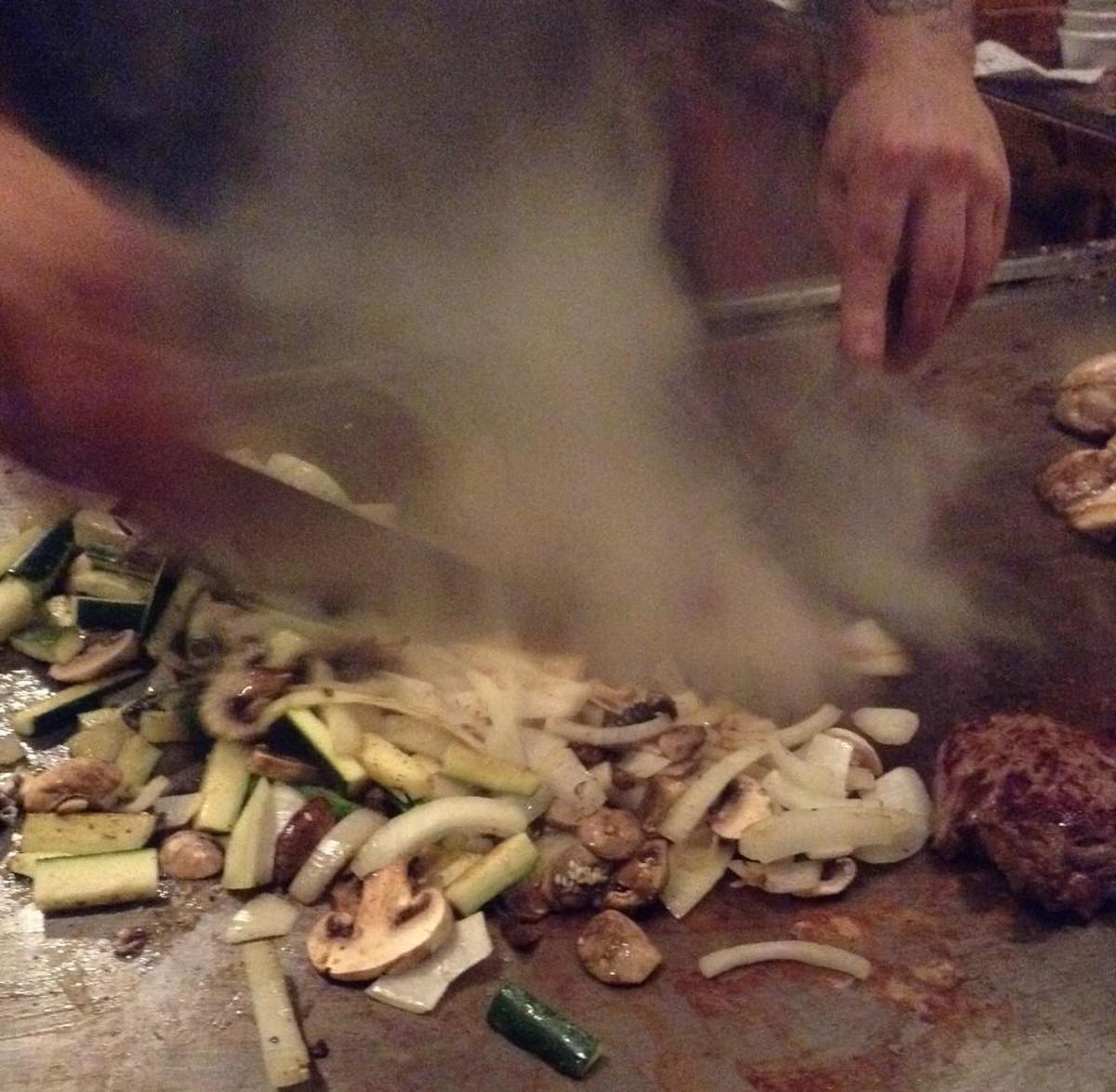 Chefs prepare the food right before you at Samurai’s Japanese Steakhouse.