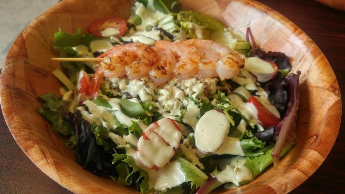 Find a marinated skewer of shrimp on top of the Aztec salad built with quinoa and avocados. Find the salad at the Garden Bar, newly opened in Tacoma.